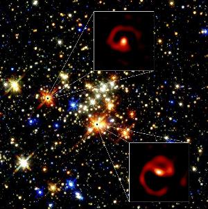 The two stars rotate around one another, spewing out dust in a spiral arc like a lawn sprinkle