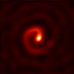 The clear dust spiral shows that a beam from this star would be aimed at Earth.